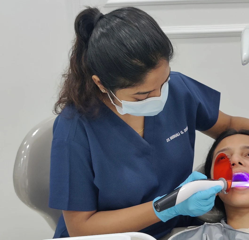 Dr. Vaishali treating a patient at her dental clinic in Wakad